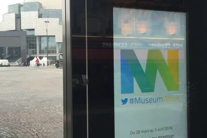 A Paris bus shelter displays the #MuseumWeek 2016 visual, in front of the Opéra Bastille.